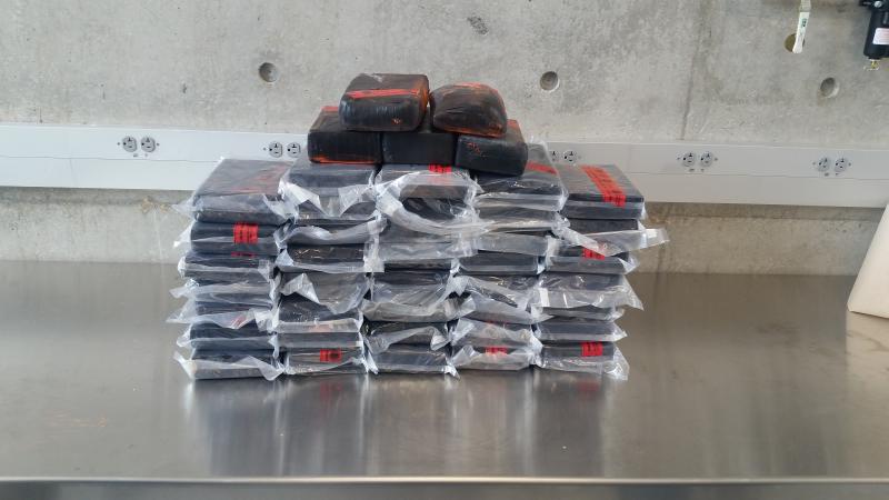 Packages containing 12 pounds of heroin and 94 pounds of cocaine seized by CBP officers at Juarez-Lincoln International Bridge