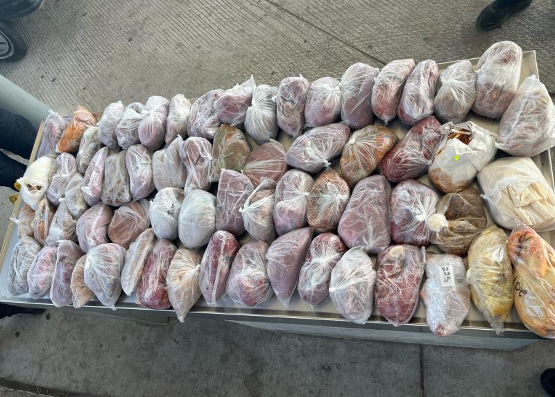 Packages containing 124 pounds of prohibited fresh pork and poultry meat seized by CBP officers, agriculture specialists at Laredo Port of Entry's Juarez-Lincoln Bridge