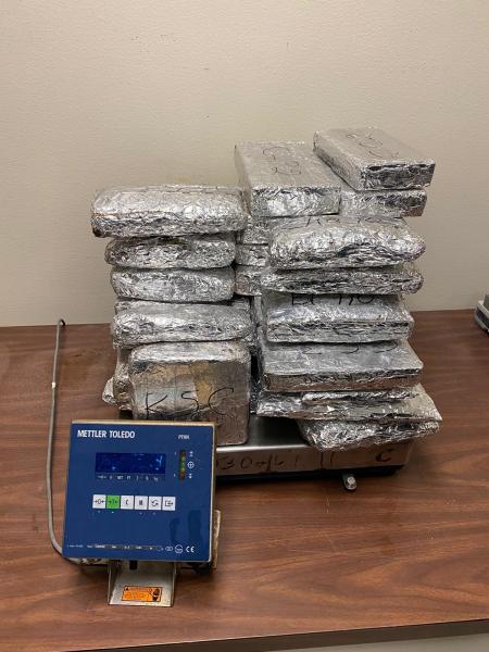 Packages containing 2.5 pounds of fentanyl, 23.59 pounds of brown heroin, 61 pounds of black tar heroin and 14 pounds of cocaine.