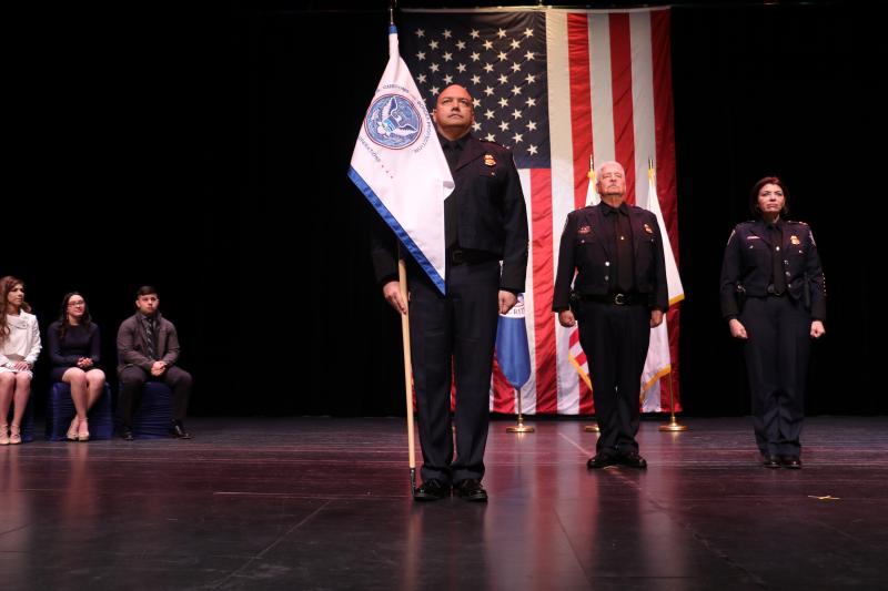 Port Director Tater Ortiz carries the CBP guidon signifying he has assumed command during his Change of Command ceremony in Brownsville, Texas