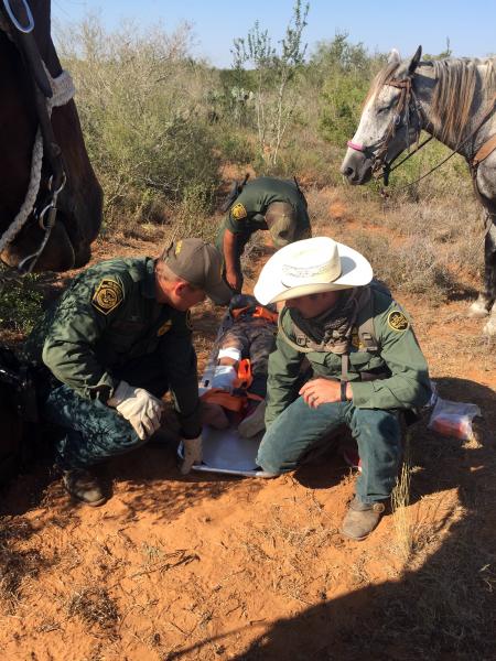 Border Patrol agents with the Laredo Sector Horse Patrol Unit assist with rescue of distressed aliens