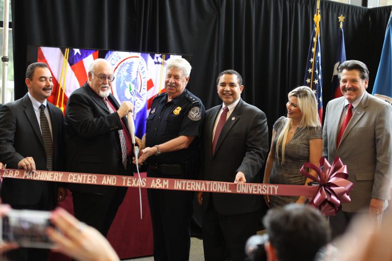 CBP, TAMIU officials together with U.S. Rep. Cuellar cut the ribbon to dedicate the new offices for the Machinery Center of Excellence and Expertise at TAMIU
