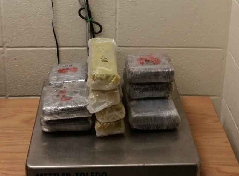 Packages containing 15.4 pounds of cocaine seized by CBP officers at Roma Port of Entry