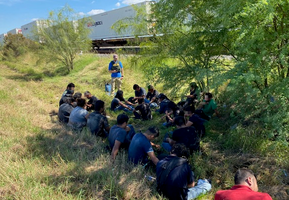 Migrants apprehended at railroad location.