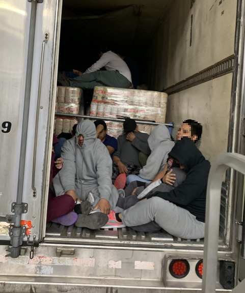 Migrants found in refrigerated trailer.