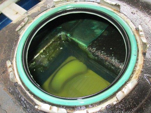 Metal compartment visible in fuel tank.