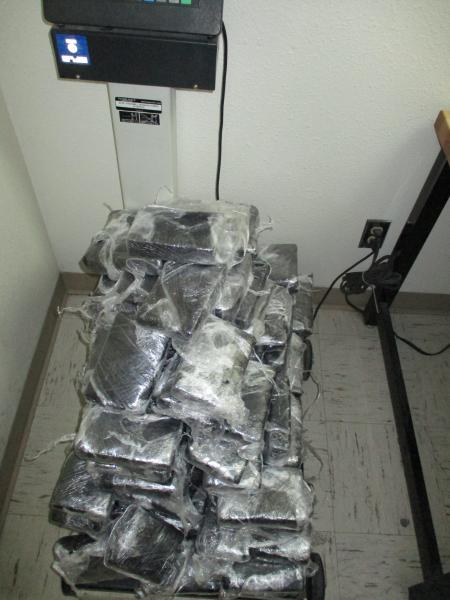 Seized drugs on scale.