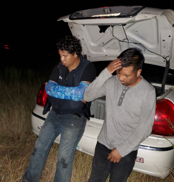 Migrants freed from locked trunk.