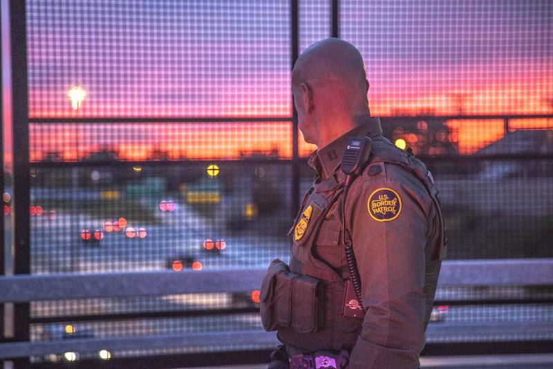 A Border Patrol agent on Patrol in Detroit as the sun sets