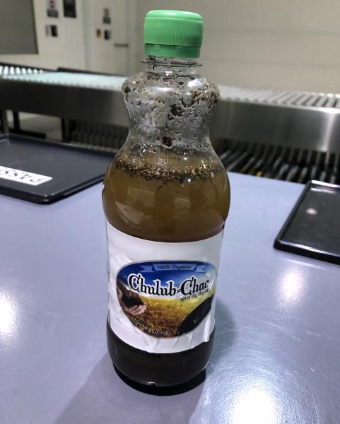 Baltimore CBP agriculture specialists seized this bottle of cattle manure fertilizer that a California couple purchased in Cancun, Mexico.