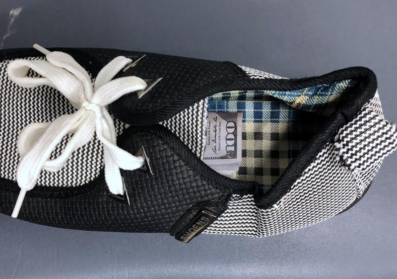 U.S. Customs and Border Protection seized $7,000 in counterfeit $100 bills concealed in a sneaker in a man’s baggage at Baltimore Washington International Thurgood Marshall Airport (BWI) on June 16, 2021.