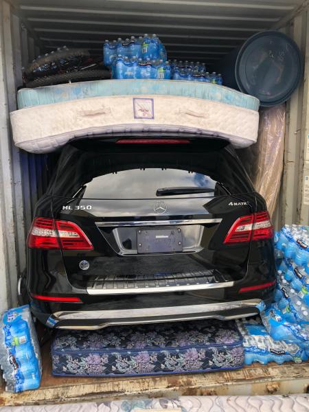 Outbound stolen vehicles, like this Mercedes Benz ML350, may be packed or concealed in shipping containers with other consumer goods.