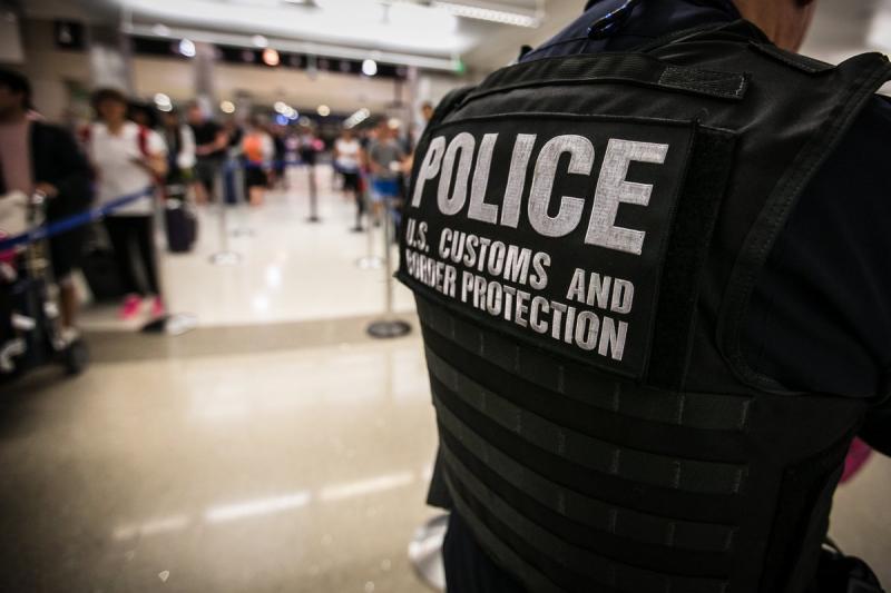 A file photo of the back patch of a CBP officer in an airport environment.