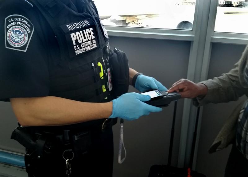 CBP officers used technology like this to confirm a China-bound traveler as the subject of an arrest warrant at Washington Dulles International Airport on March 7, 2017.