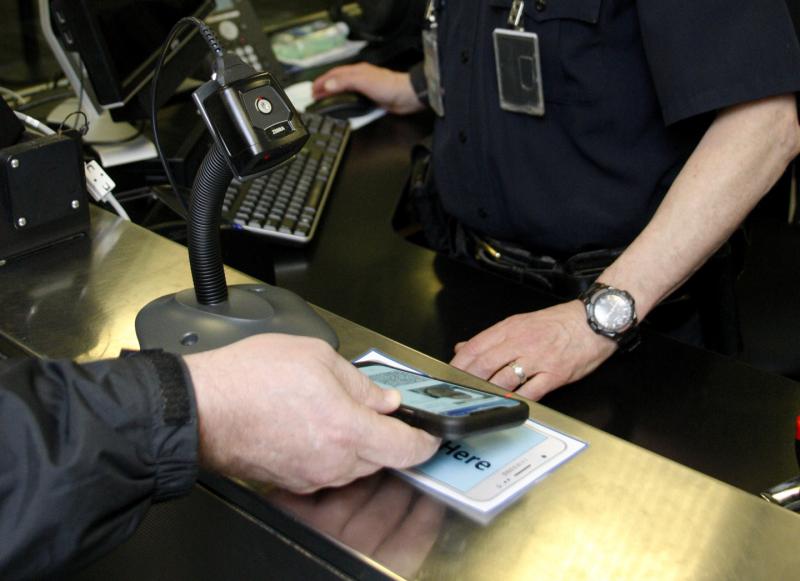 A traveler uses the Mobile Passport Control option to enter the United States. (CBP File Photo)