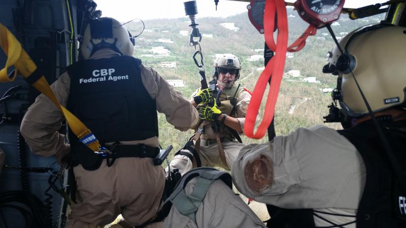 An AMO Air Enforcement Agent starts to rappel down into the British Virgin Islands to assist Irma victims.  