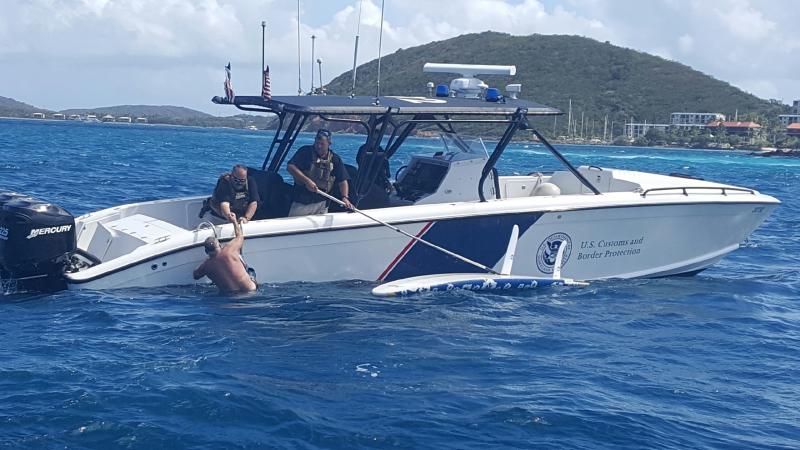 AMO agents pull a man from the water in St. Thomas