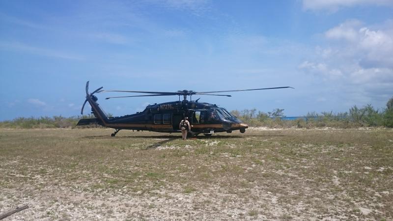 An AMO blackhawk in Mona Island preparing for migrant transport.