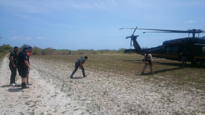 Cuban migrants board a CBP Blackhawk in Mona Island