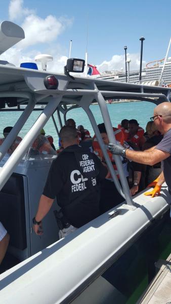 Marine units transport passengers to Pier 6 in San Juan. 