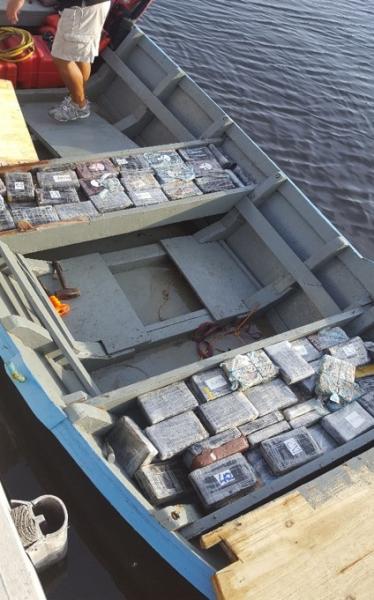 Compartments filled with cocaine bricks inside a "yola" type wooden vessel. 