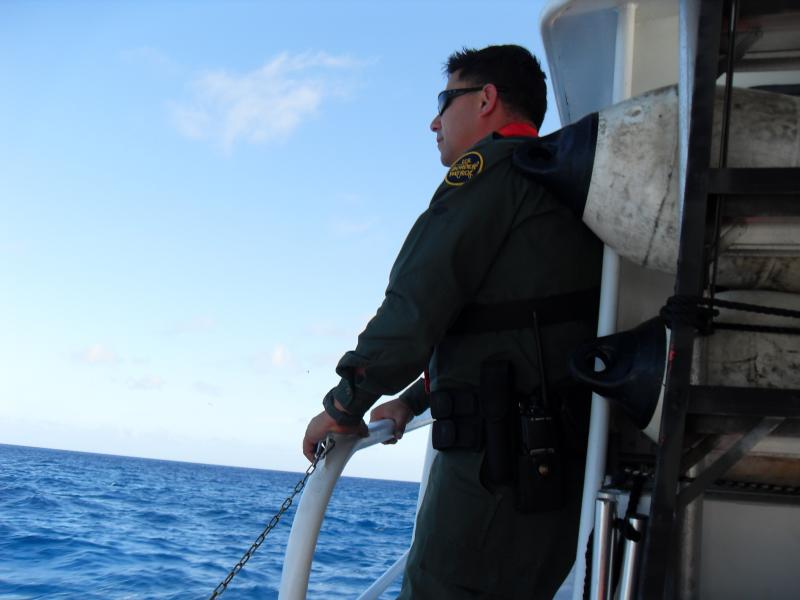 Border Patrol Agents board a USCG cutter to interivew migrants in Mona Island