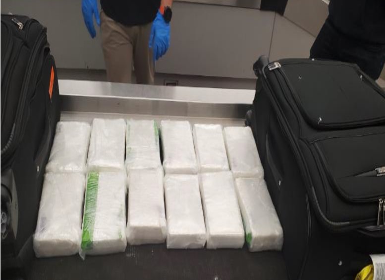 Bricks of cocaine were found within the clothes inside the luggge bound to Orlando, Florida