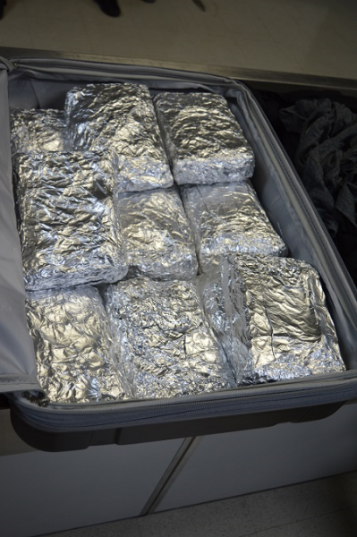 18 bricks of cocaine were found wrapped in foil inside the checked bag.  