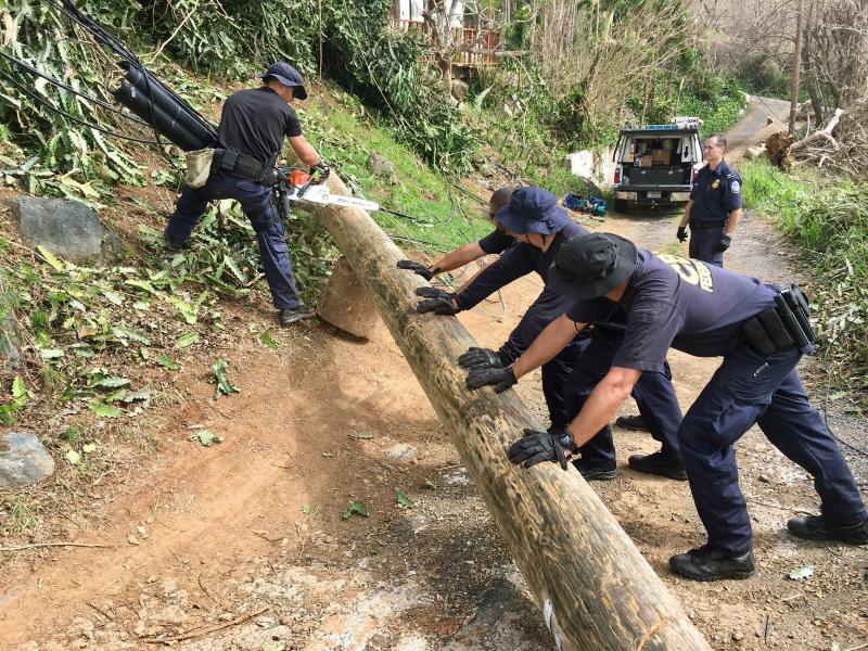 CBP officers clear debris caused by Hurricane Maria.