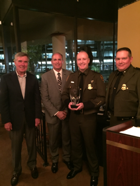 Commissioner Kerlikowske congratulates  Border Patrol recipients of the IACP/Cisco  Community Policing Award.