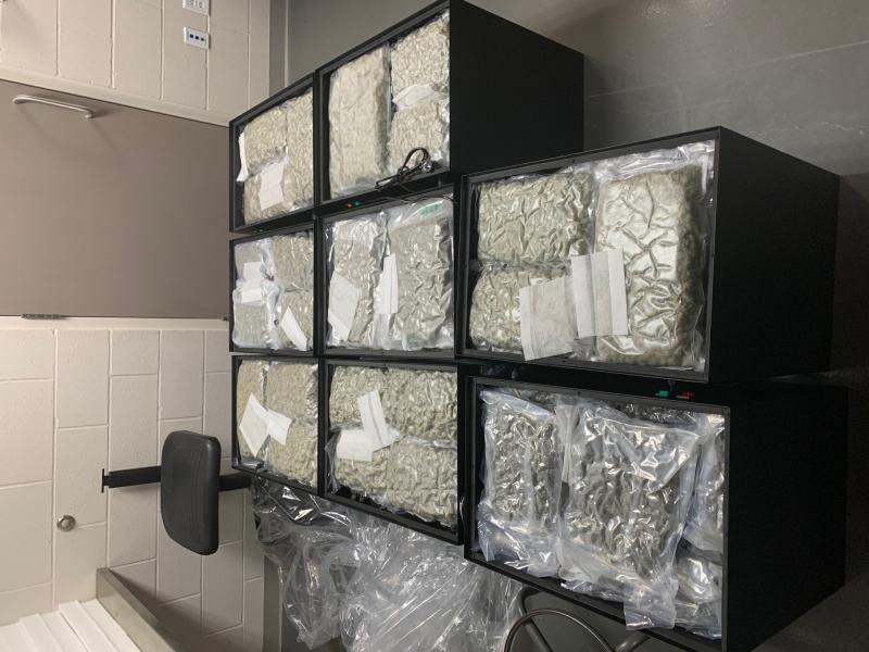 Vacuum-sealed marijuana discovered in cabinets.