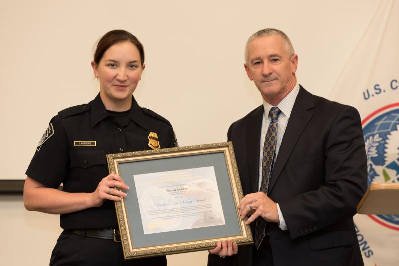 CBP Officer Daina Lambert accepts an award for her heroism during a multi-car accident.