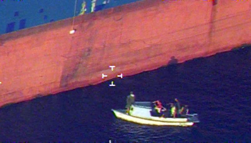 CBP Air Crew overhead as Fisherman taken aboard freighter in Gulf of Mexico