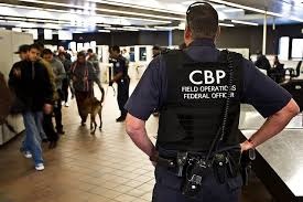 CBP officers monitoring travelers in airport