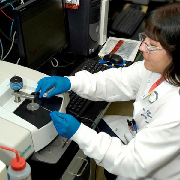 Photograph of Female working in a chemical laboratory. Click photo for more info on CBP professional positions.