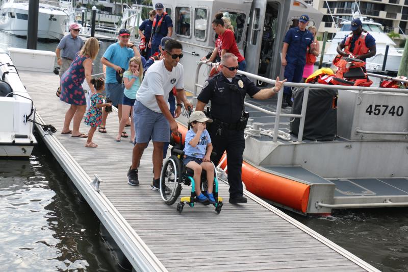 Marine units cheered as the young boy climbed aboard a vessel for a joint patrol.