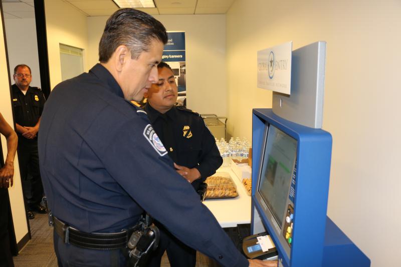CBP officer demonstrates Global Entry kiosk