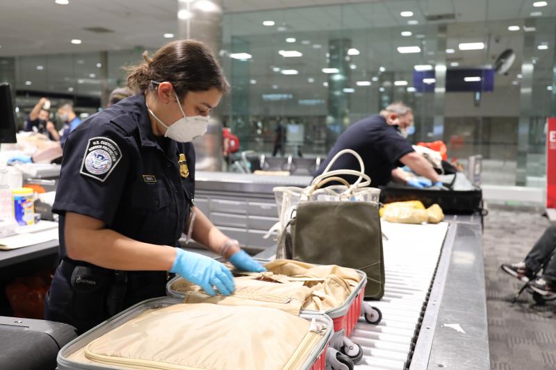 CBP officers inspect packages
