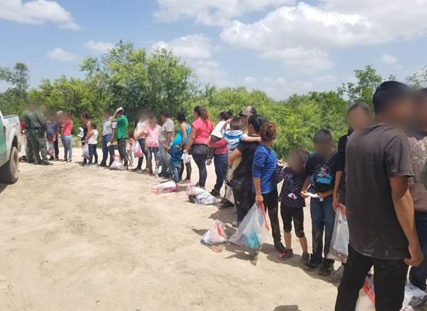  31 illegal aliens along the riverbank of the Rio Grande near Hidalgo, Texas.