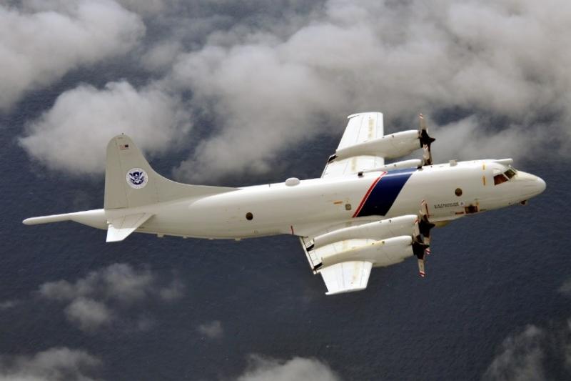 Photograph of a CBP Air and Marine Operations P-3 Long Range Tracker aircraft flying during an operation.