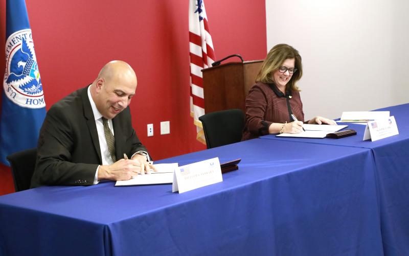 Photo of CBP Executive Assistant Commissioner William Ferrara and U.S. Chamber of Commerce President and CEO Suzanne Clark signing the MOU