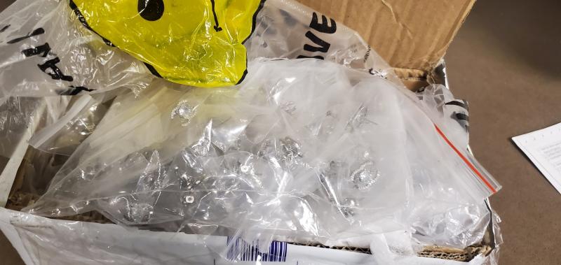 Cheap plastic of packaged fake Chanel earrings that they were shipped in.