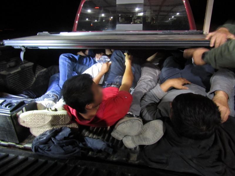 Truck bed with people locked inside.