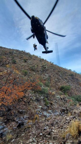 AMO conducts 125-foot hoist to rescue woman from the Baboquivari Mountains.