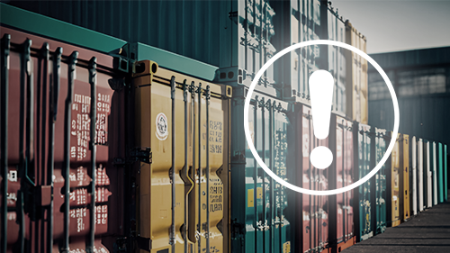 Shipping containers with an exclamation mark icon overlaid on top.
